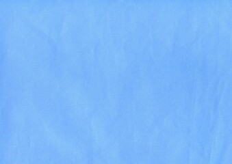 Sky blue surface of an old paper or cardboard, background, texture. Backdrop of blue paper surface...