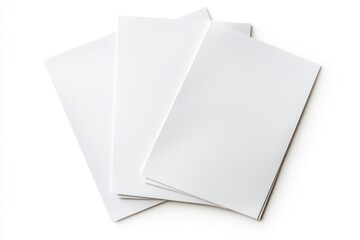 Blank paper brochures stacked, studio shot, white background, marketing mockups