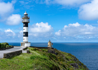 Distant View of San Agustin Lighthouse Overlooking the Ocean in Ortiguera, Asturias.