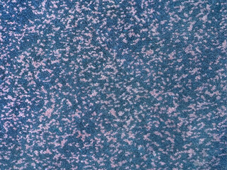 Close up of carpet rug tuft in blue and cyan color. Tuft pattern, dirt and grunge. Seamless carpet rug background texture.