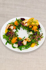 Unique salad arrangement featuring fresh vegetables and grilled chicken