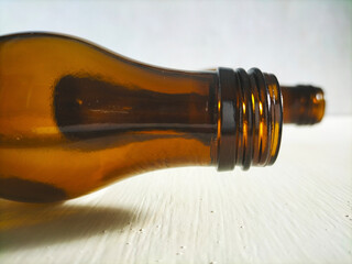 brown bottle on white table