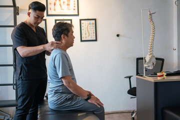 A chiropractor assists a patient in a healing session focusing on spinal health and posture.