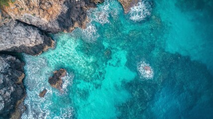 Fototapeta premium Aerial View of Turquoise Ocean and Rocky Coastline