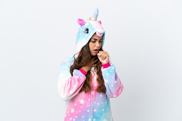 Young caucasian woman wearing a unicorn pajama isolated on white background is suffering with cough and feeling bad