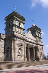 front entrance and twin towers of landmark church exterior built in gothic style architecture in las palmares province of costa rica 