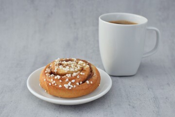Traditional Swedish fika, cinnamon buns (kanelbullar) with coffee.