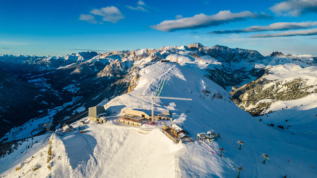 The Stazione di Arrivo Funivia Campitello and the Forcella del Sassolungo stand out in the breathtaking Val di Fassa ski resort in winter time captured by drone