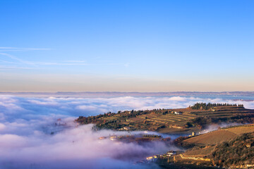 View of vineyard hills with low clouds, valpolicella, italy