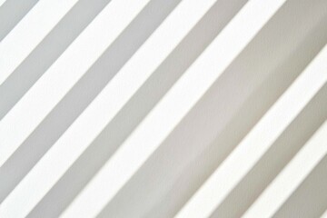 Obraz premium Diagonal light streaks on white surface, interior, blurred background, texture design