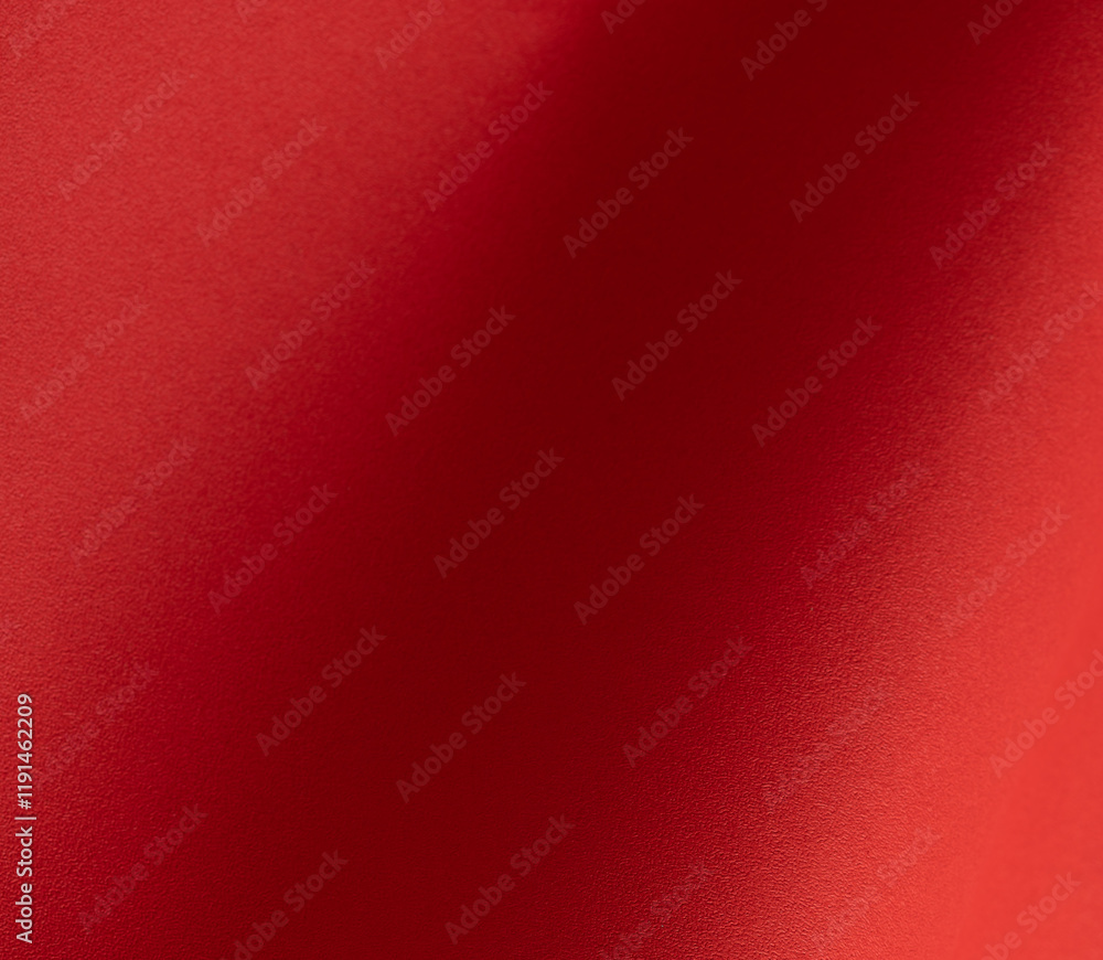 Poster Red paper background with fiery tones and a soft matte gradient. Warm and vibrant hues blend seamlessly with smooth textures, deep shadows, and a striking grainy pattern.