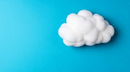 Floating Cloud on Blue:  A single, fluffy white cloud, seemingly weightless, drifts across a vibrant blue background, offering a simple yet evocative image of possibility and freedom. 