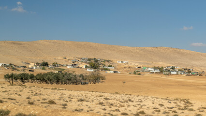 Primitive Bedouin dwellings and animals in the Negev Desert in southern Israel.
