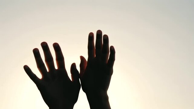 Hands Raised in Worship at Charismatic Christian Service