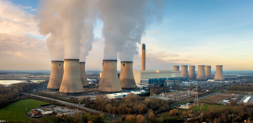 Aerial landscape panorama of large coal fired Power Station in UK countryside at sunset