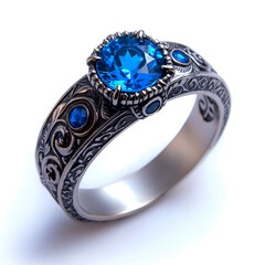 Elegant Vintage Blue Gemstone Ring with Intricate Engravings and Timeless Craftsmanship