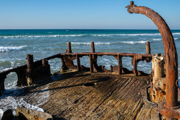 Close up of and abandoned rusty shipwreck at HaBonim Beach Nature Reserve on the Mediterranean Sea...