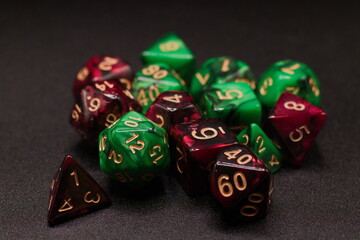 Close-Up Red & Green Dice Rolling on Black