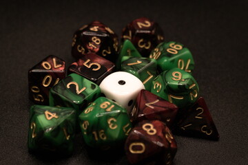 Single White Dice Close-Up Isolated on Black with Red & Green