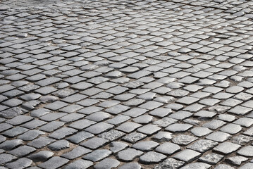 Old paving stones on the road.
