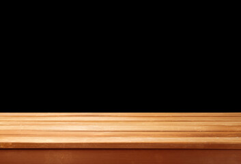 Empty wooden table on black background