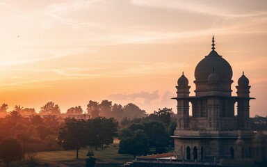 Obraz premium Sunset over a majestic stone dome structure in a park.