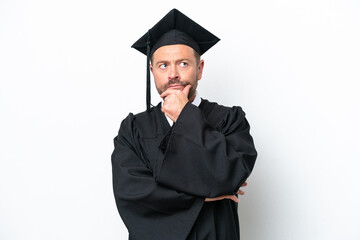 Middle age university graduate man isolated on white background having doubts and with confuse face expression