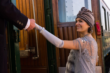 1920s lady getting on the train