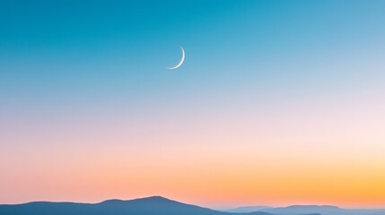 Fototapeta premium Crescent Moon Over Tranquil Mountain at Dusk