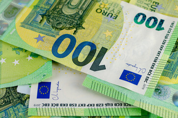 Close-up of 100 Euro Banknotes: Symbol of European Currency and Wealth