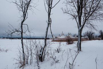 View of the Kirillo-Belozersky Monastery from the lake side through the trees. Vologda Region
