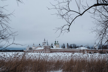 View of the Kirillo-Belozersky Monastery from the lake side through the trees. Vologda Region