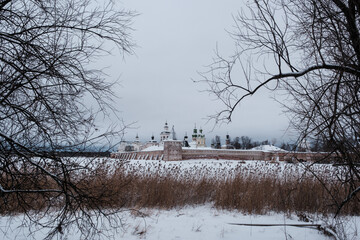 View of the Kirillo-Belozersky Monastery from the lake side through the trees. Vologda Region