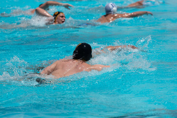 Athletes in swimming pool. Water polo competition