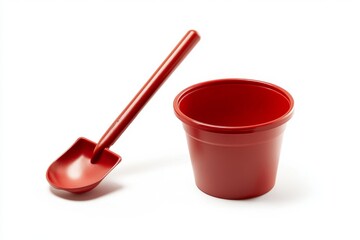 Fototapeta premium Red Plastic Shovel and Bucket Playset for Kids