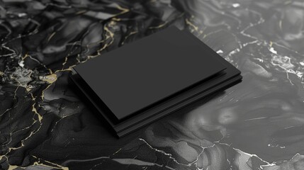 A black card is sitting on a marble countertop