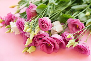 Delicate blooming festive eustomas summer flowers, blossoming lisianthus (prairie gentian) flower background, bright bouquet floral card, selective focus