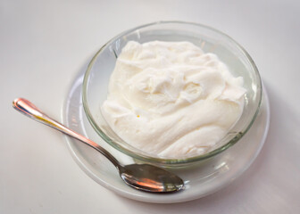 Sweet whipped lemon mousse served in bowl for dessert