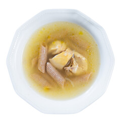 Delicious traditional chicken soup with pasta served in bowl. Isolated over white background