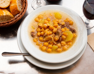 Popular dish of Spanish cuisine is Cocido de garbanzos, made from meat, vegetables and chickpeas