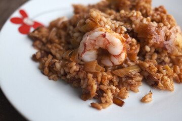 typical spanish rice with seafood or meat and mushrooms