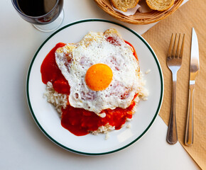 Delicious rice with sauce and fried eggs. Cuban cuisine