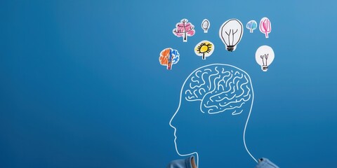 silhouette head with hand drawn ideas floating above in bright whimsical doodles on plain blue copyspace concept of creativity marketing psychology