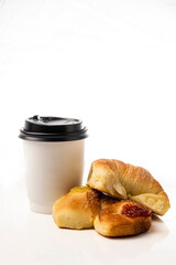 Takeaway coffee cup with two croissants on a white background
