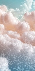 Obraz premium Pink and white foam creating a dreamlike cloudscape with soft bubbles drifting against a serene blue sky backdrop, inviting feelings of relaxation and tranquility