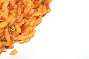 Close Up of Tomoto Based Orzo Rice Sauce Dinner Snack Dish on a White Background