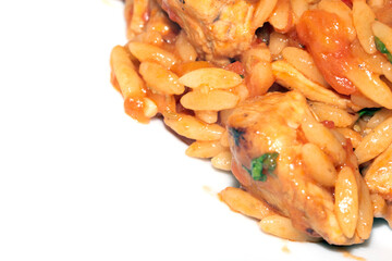 Close Up of Tomoto Based Orzo Rice Sauce Dinner Snack Dish on a White Background