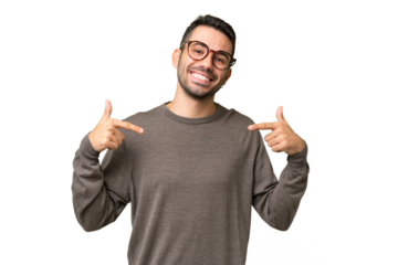 Young handsome caucasian man over isolated background proud and self-satisfied