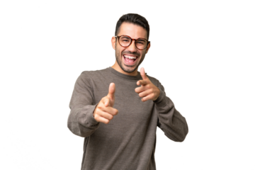 Young handsome caucasian man over isolated background pointing to the front and smiling