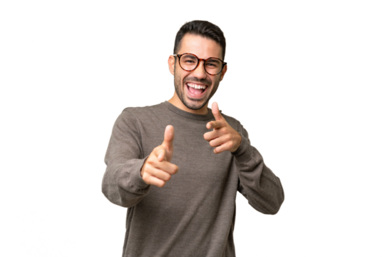 Young handsome caucasian man over isolated background pointing to the front and smiling